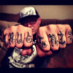 "True Grit" Tattoos on the fingers of Patrick McGirr