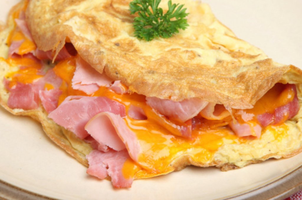 Lucile's Creole Omelet takes a twist on the classic ham and cheese sandwich.