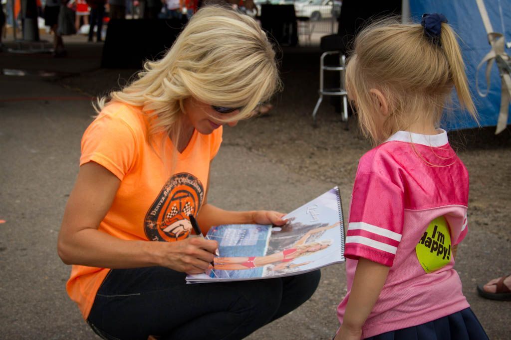 Broncos' cheerleader wears CO designer's swimsuit in calendar