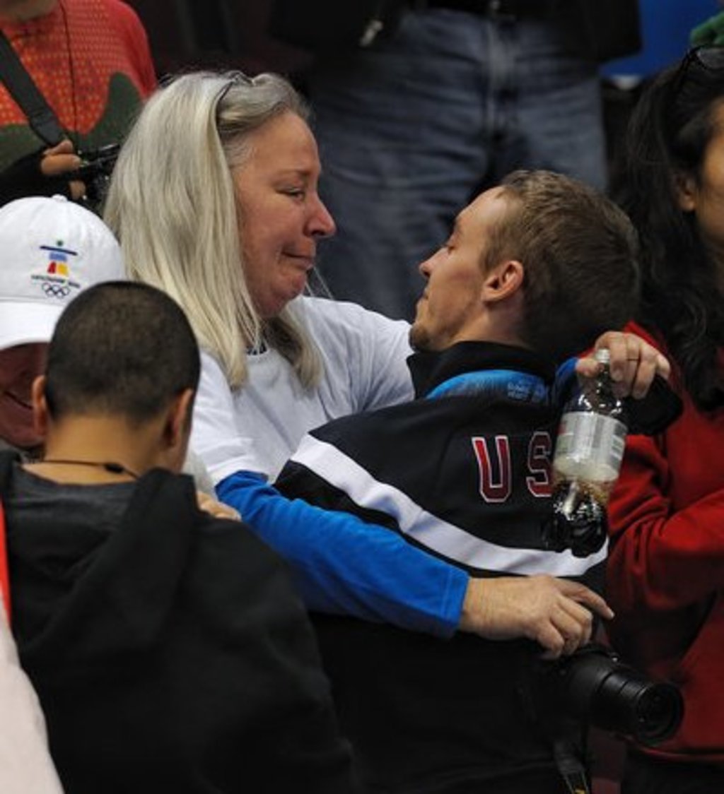 Jordan hugging his mother, Peggy, after receiving his first olympic medal in Vancouver 