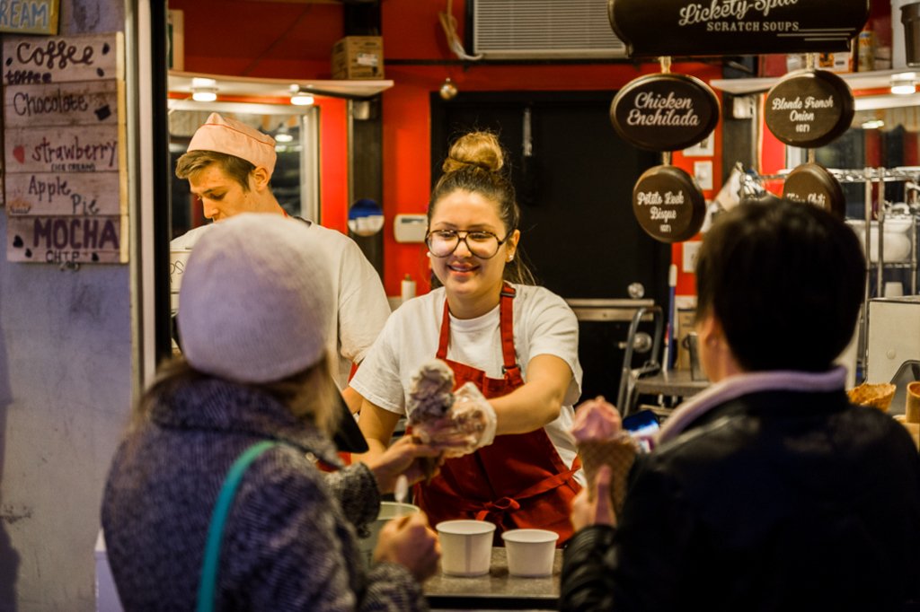 A Smiling Employee and Happy Customers at Little Man Ice Cream. Photography by Glenn Ross. 