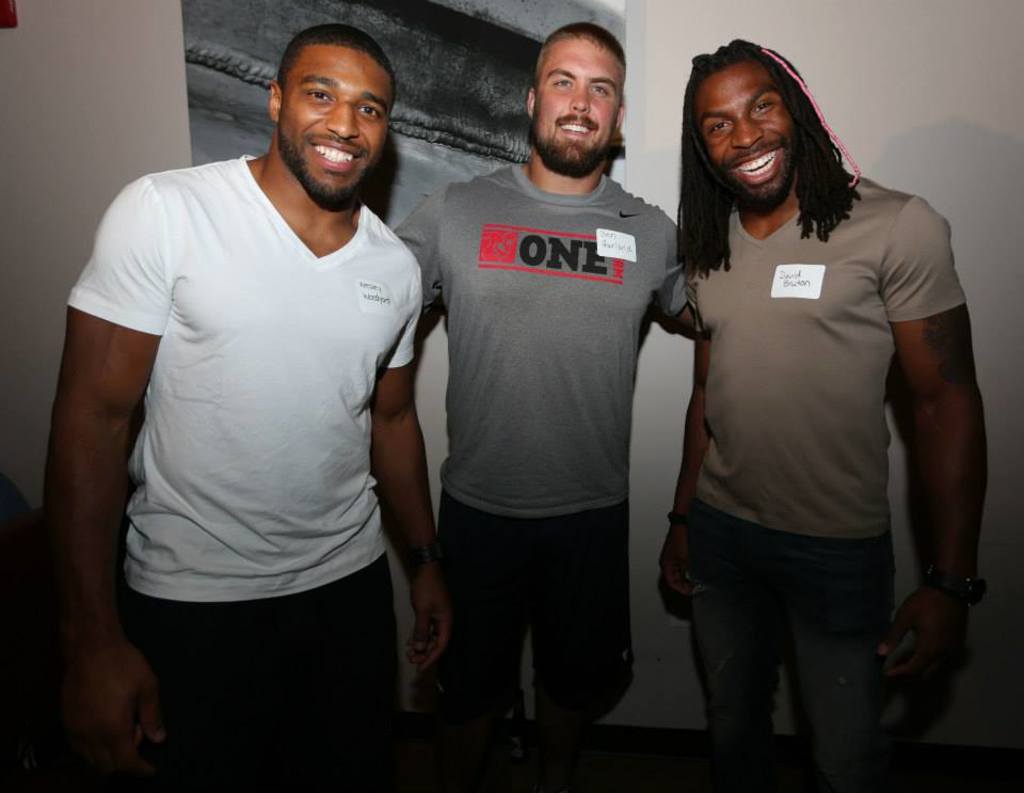 Wesley Woodyard, Ben Garland and David Bruton in photo from 2013 Touchdowns For Trivia night. Photo by Stuart Zaas.