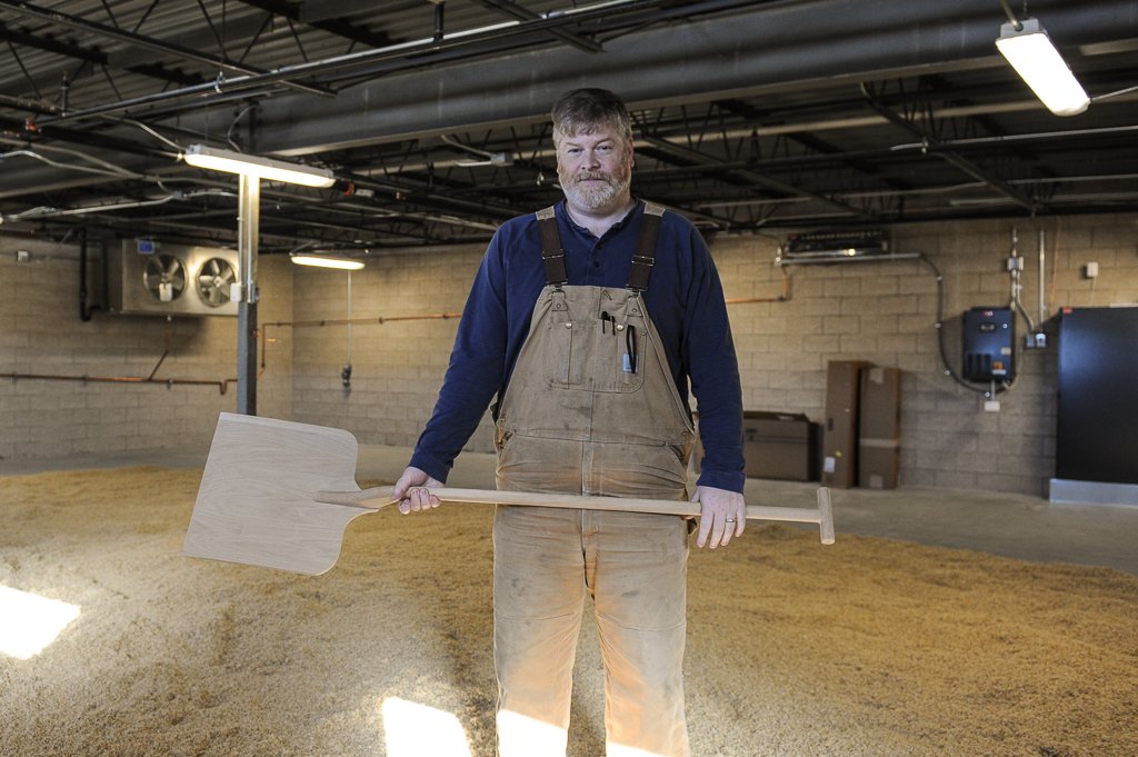 Todd Leopold standing in Leopold's Bros. Malting floor room. Photo by Glenn Ross