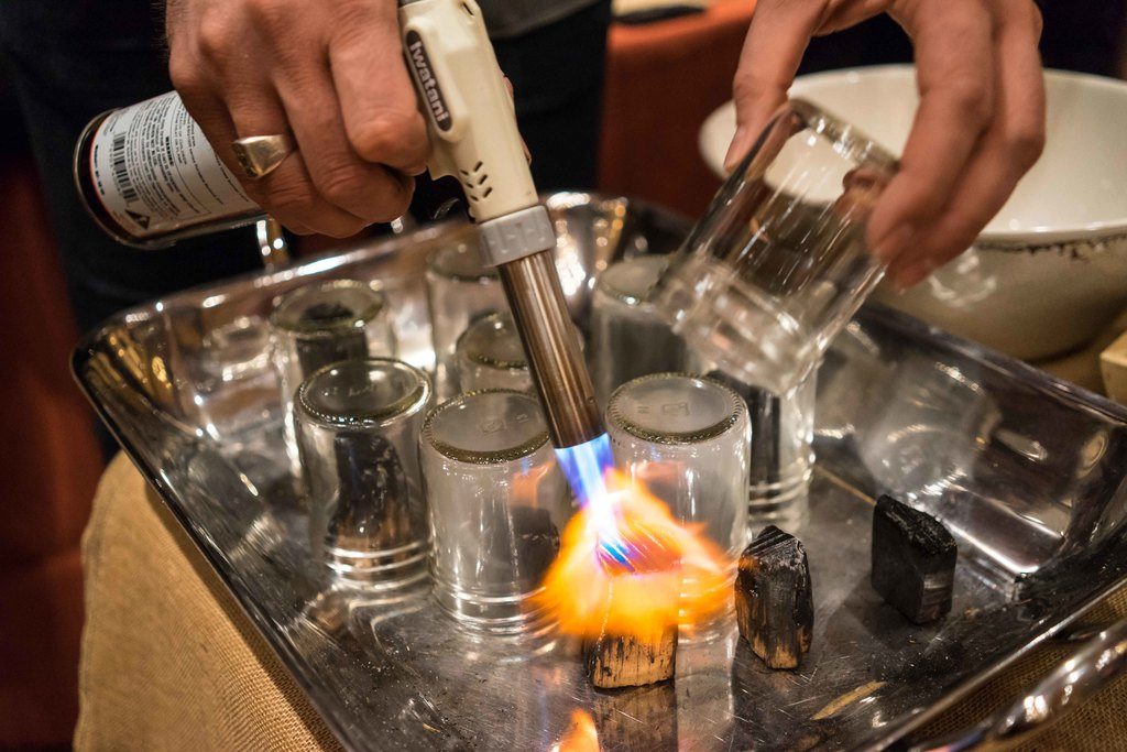 Torching for smoked old fashion cocktails.