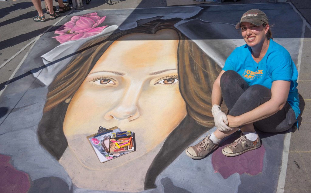 Dawn Wagner's original work was designed for the "age of the smartphone." It was constructed to be viewed and photographed from one vantage point. Wagner has been participating in chalk art festivals for 29 years and started at the original competition in Santa Barbara. She has participated in Denver's Chalk Art Festival for fourteen years.