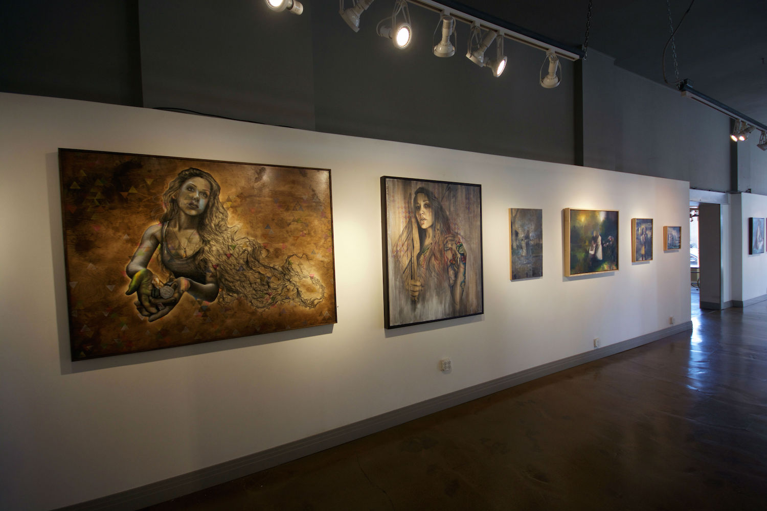 Inside the exhibition, looking at works by Rashelle Stetman. Photo by Abend Gallery