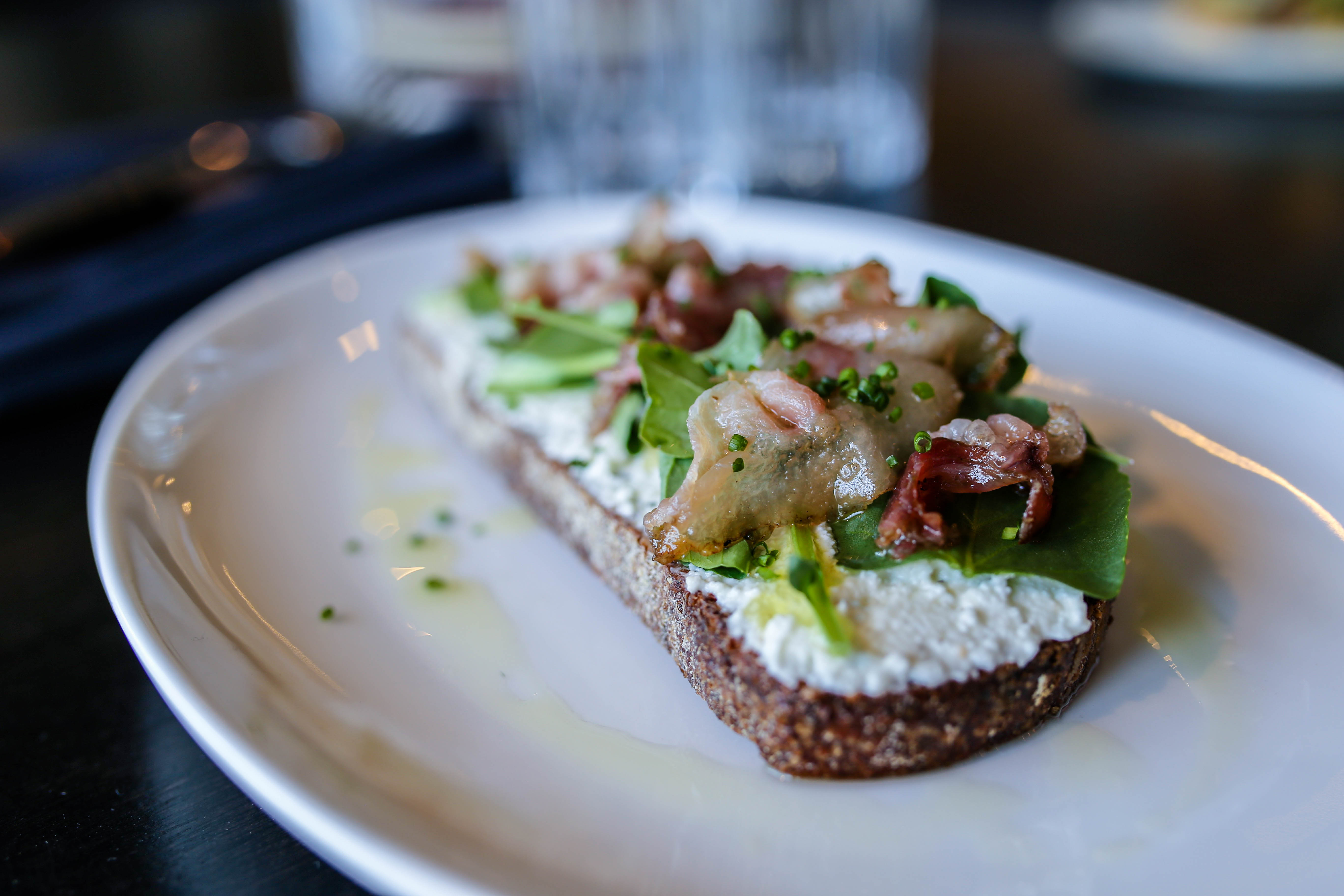 House ricotta toast with cured guanciale. 
