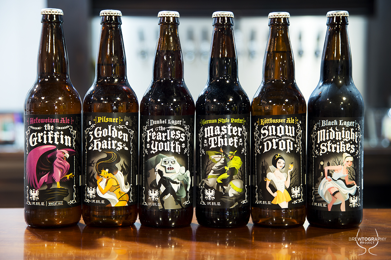 Grimm Brothers Brewhouse's fable-inspired beers and label art on display at their taproom in Loveland, CO. Photo courtesy of Dustin Hall of Brewtography Project.