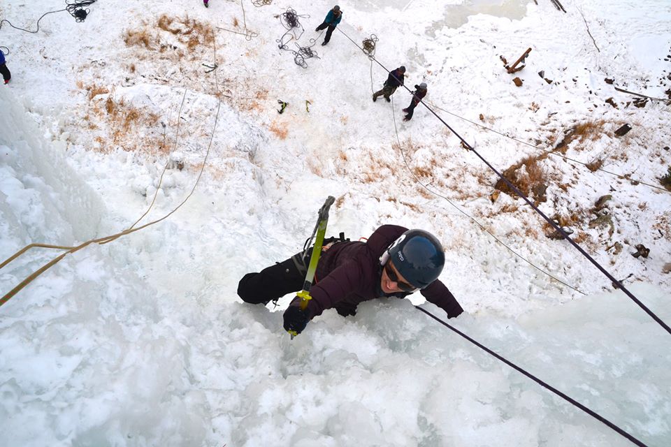 woman climbs ice wall