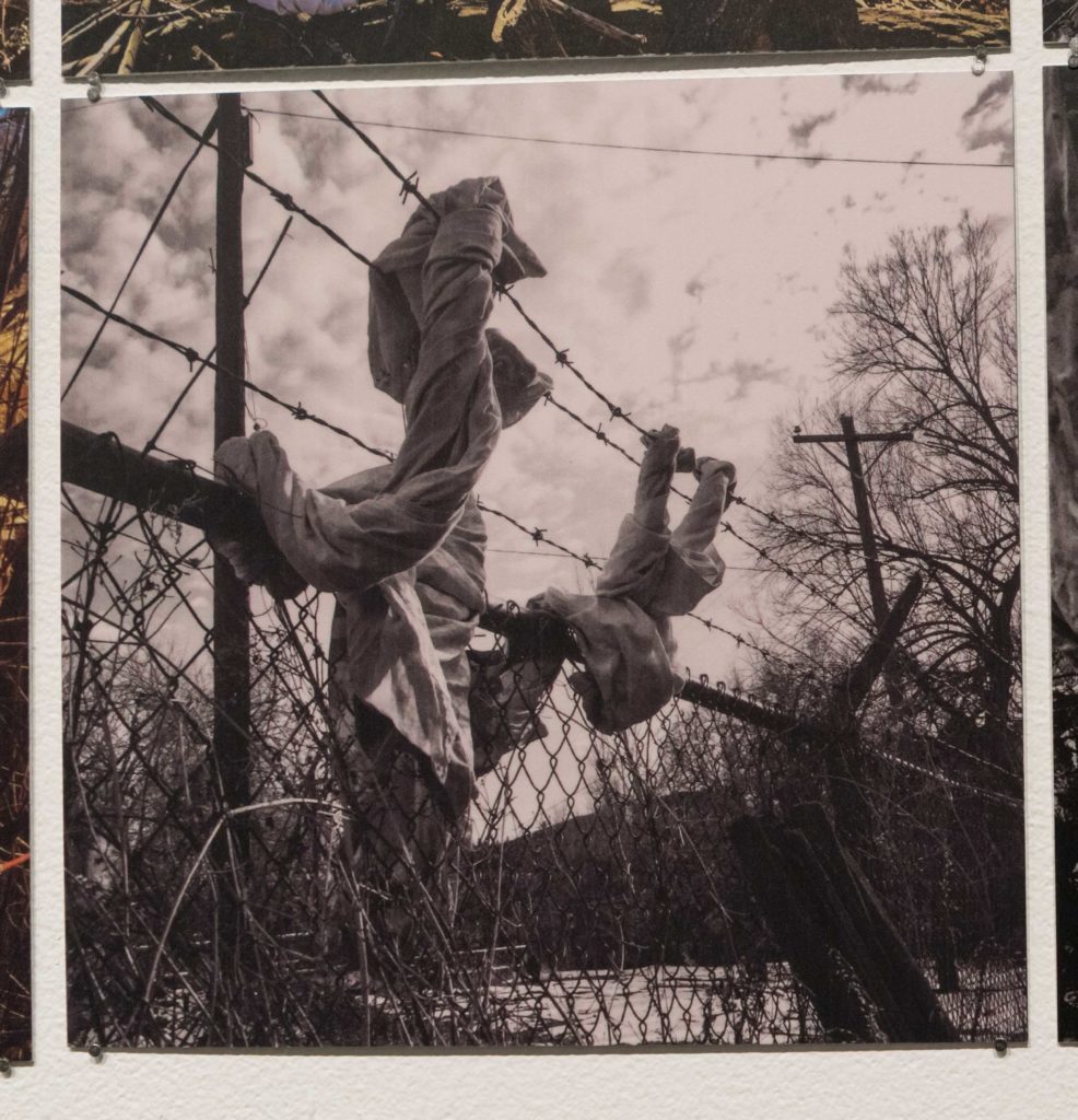 Curtains over barbed wire.