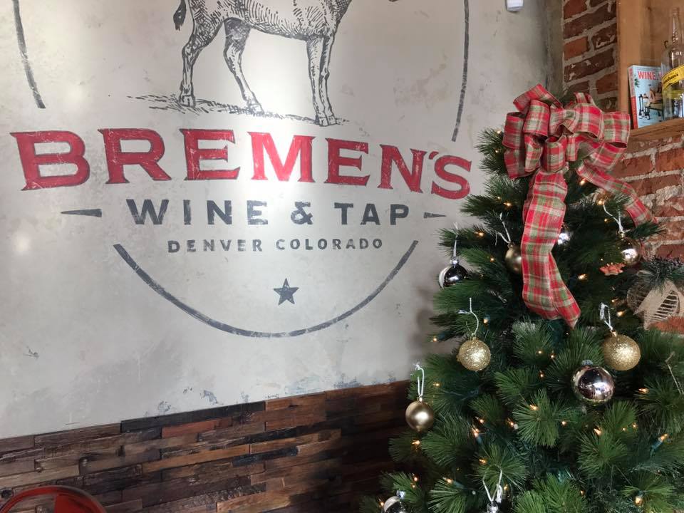 Bremen's Wine and Tap sign with a Christmas tree