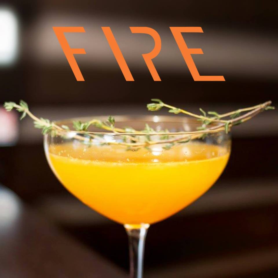A cocktail with FIRE logo above it