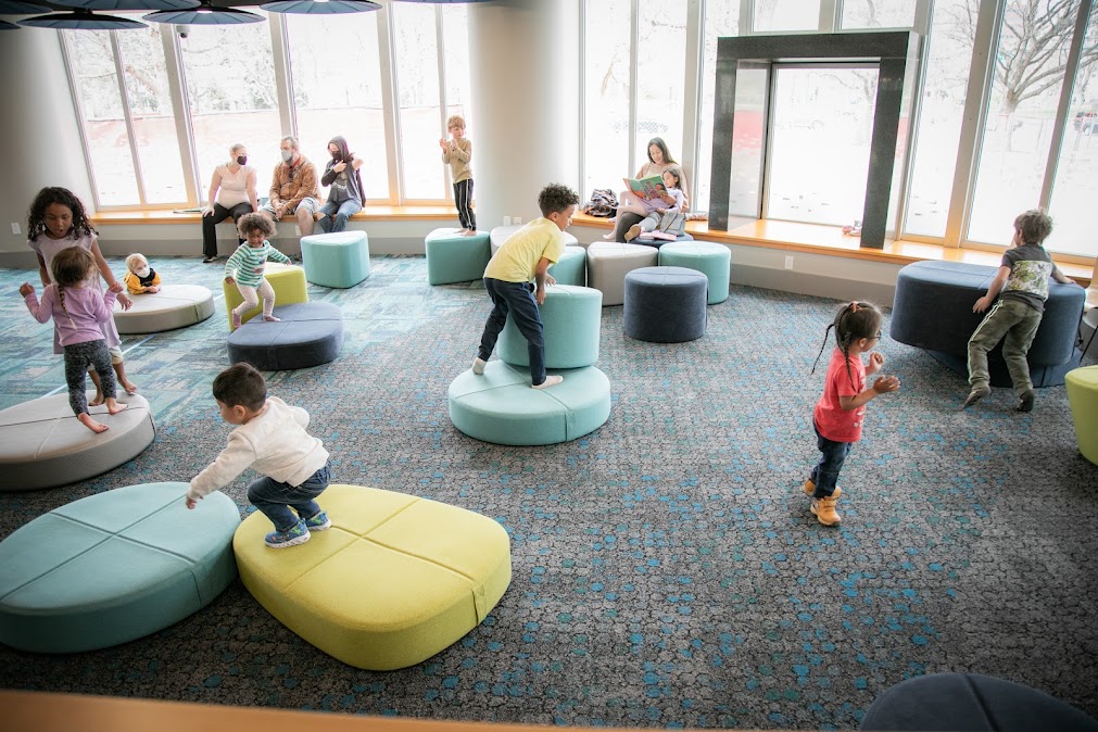 Kids playing in a library