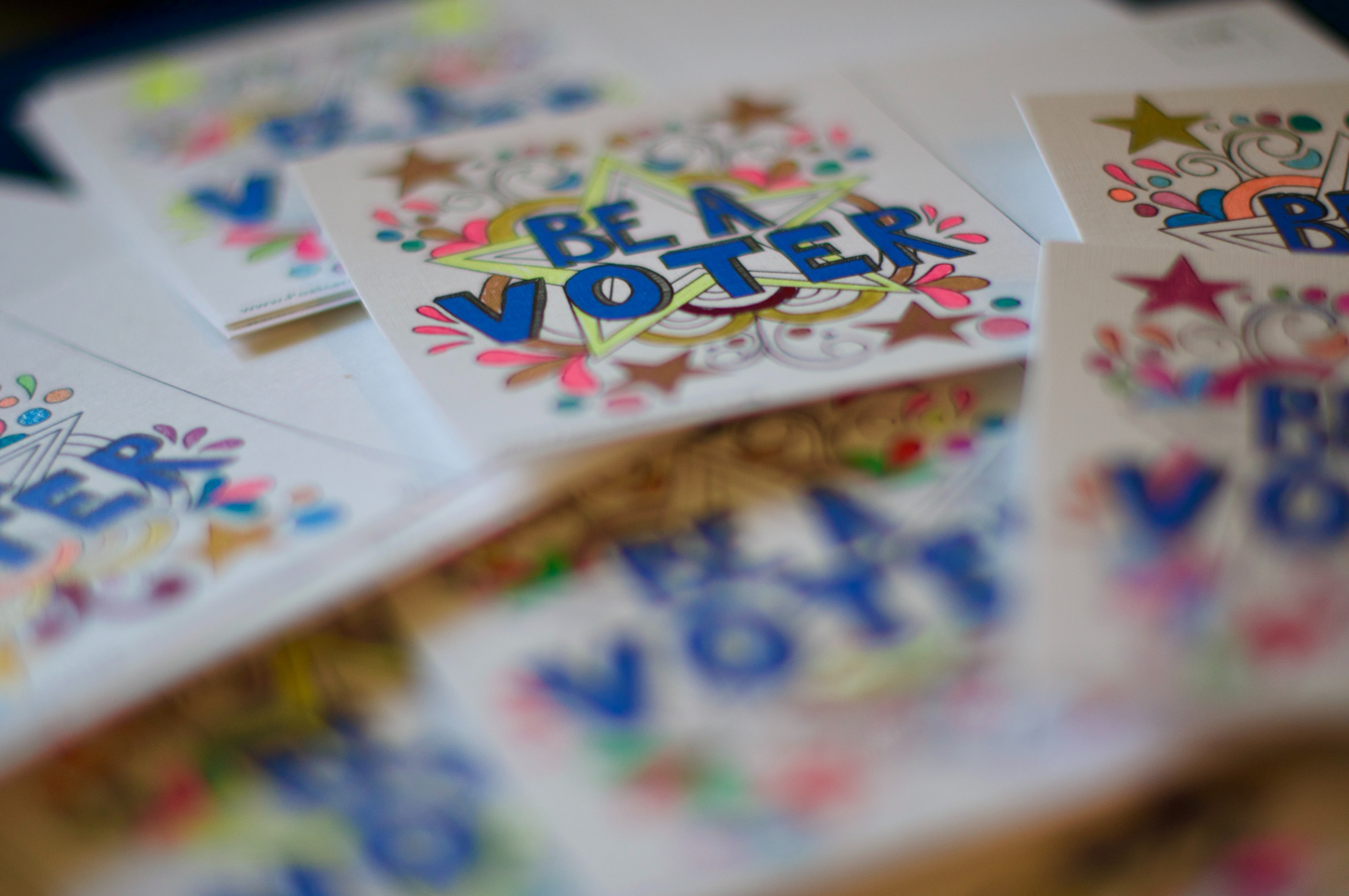 Cards that say "Be a voter"