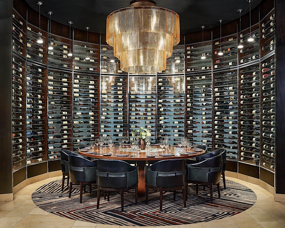 Dining room, wine bottles, tables, chairs